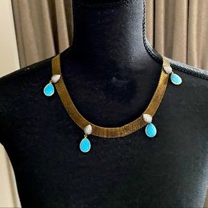 Turquoise mesh necklace.